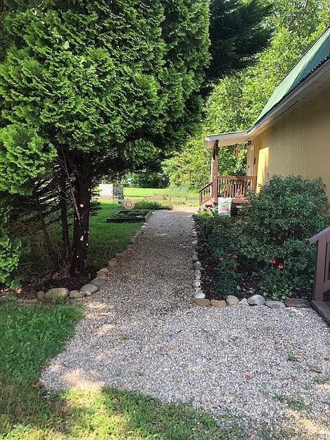Entrance to apartment ( stairway up is behind the building ) Has a shed for some storage and garden equipment
