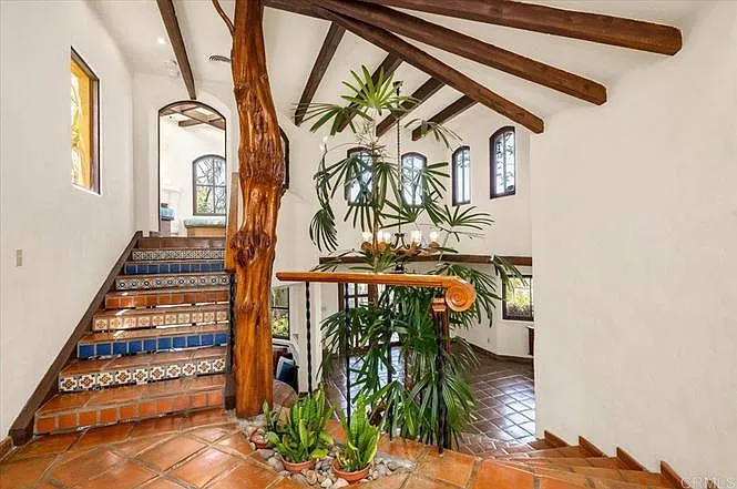 Steps lead to a fireplace nook and upstairs "wine patio".