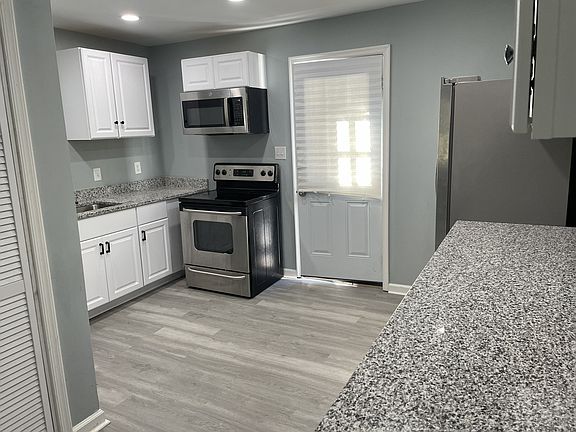 deep sink, garbage disposal, microwave, range, french door refigerator lots of cabinet space ...