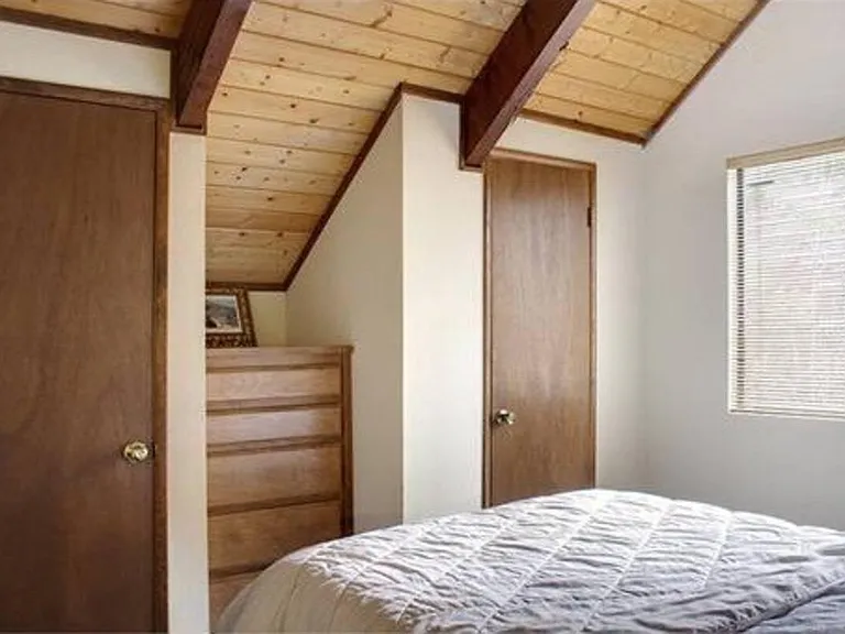 His and hers closets with built-in dresser
