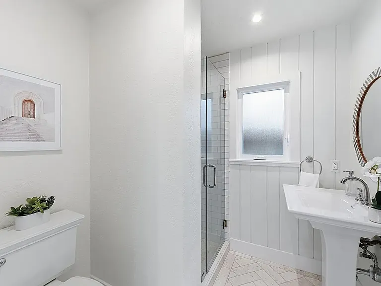 Bathroom 2, On-suite bathroom. Shiplap wall, pedestal sink, Limestone 
"Herringbone" pattern floors