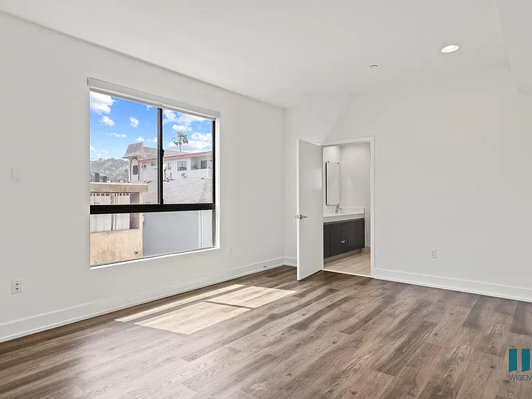 Spacious Bedroom with Bathroom and Windows