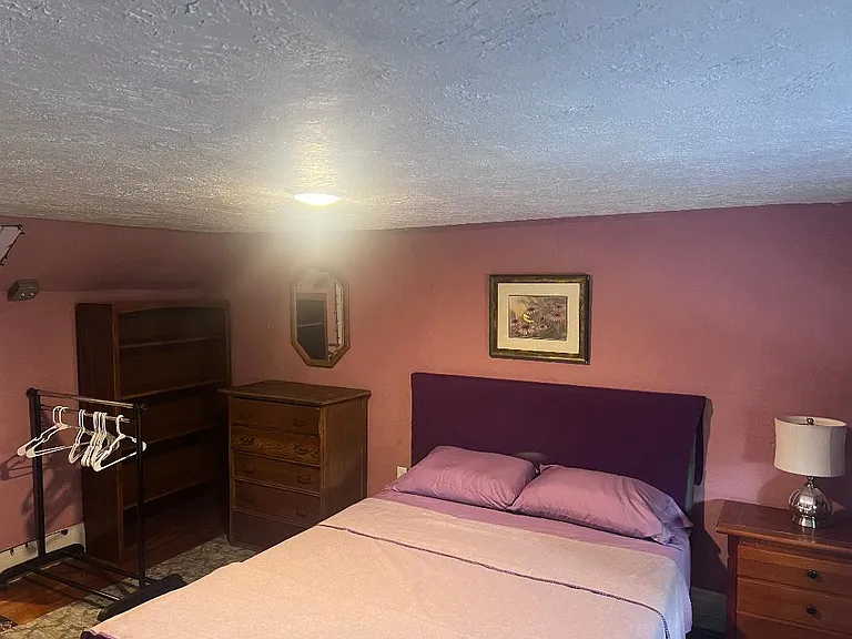 2nd floor bedroom #2. Queen bed with dressers and work area
