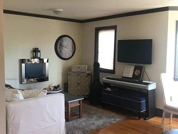 Living room, faux fireplace, hardwood floors throughout. TV mount included.