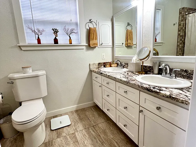 Large, elegant and private, upstairs master bathroom with double sinks.