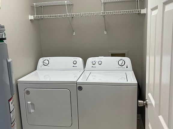 Ample laundry room with full-size washer and dryer included.