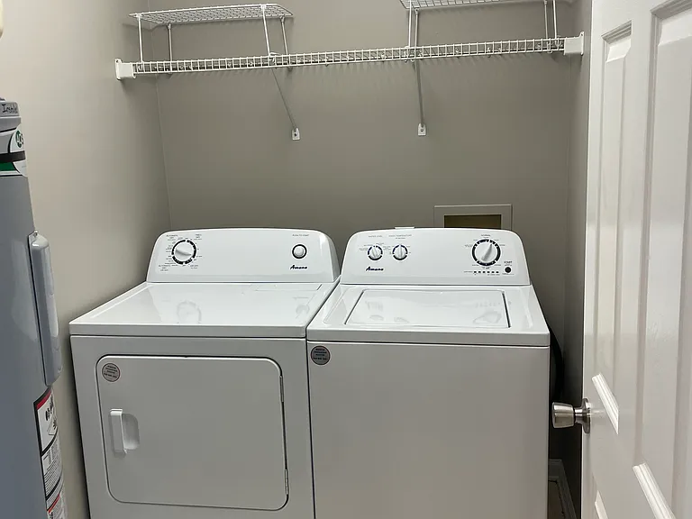 Great laundry room with full-sized washer and dryer