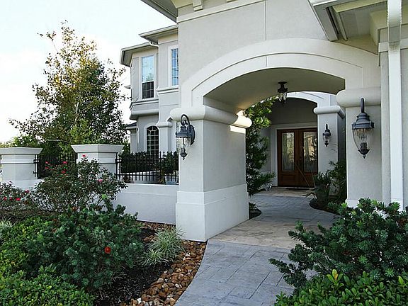 Front Entry leads you to serene courtyard complete with water and electric hook up for a fountain