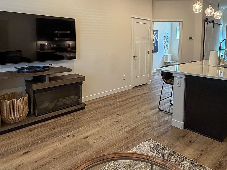 New 65 inch TV over Fireplace viewed from Living Space