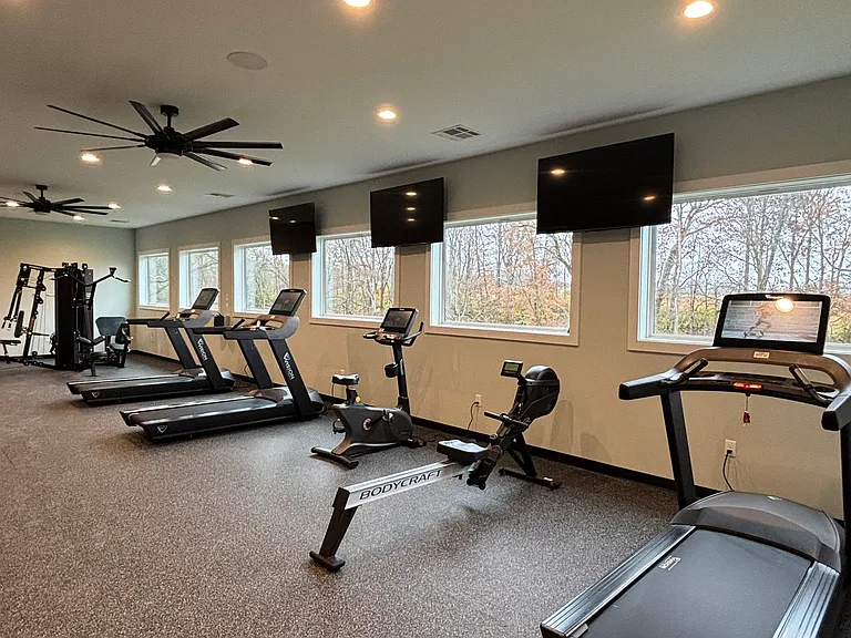 Brand new Wi-Fi connected cardio machines overlooking the park.