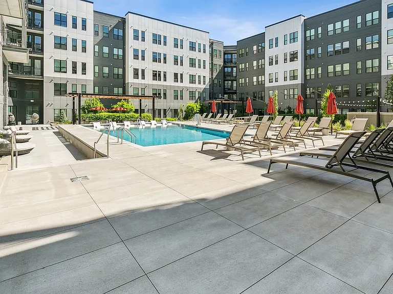 Lounge, swim, and socialize on this sun-drenched pool deck designed for ultimate relaxation.