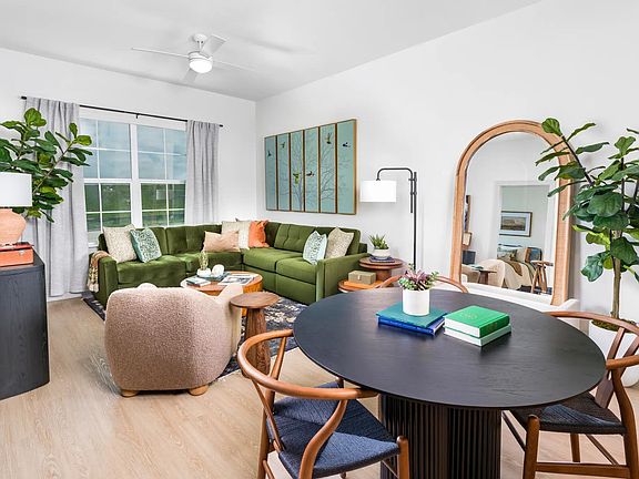 Thoughtfully designed living areas feature wood-style flooring and smart tech for effortless living.