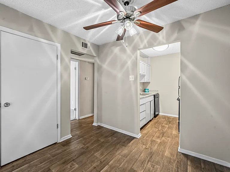 Vinyl floor dining room area with closet space.