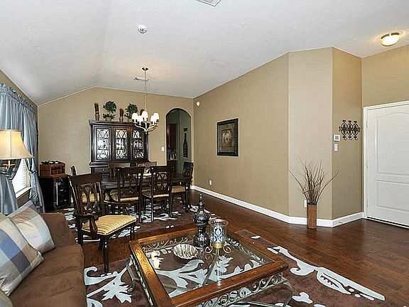 The formal dining area adjoins the formal living room. The door on the right in the photo opens into