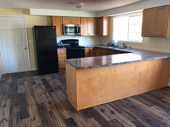 Kitchen showing breakfast bar