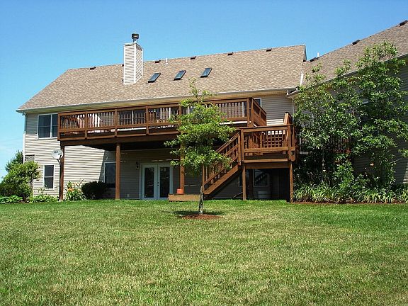 Back of home with deck...