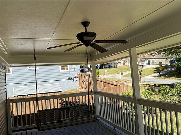 Another view of front porch swing and fan