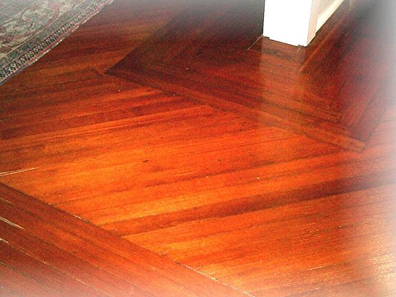 Stunning inlaid hardwood floors are one of the many features thru the home