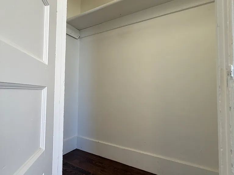 Large walk in closet of 1st bedroom.
