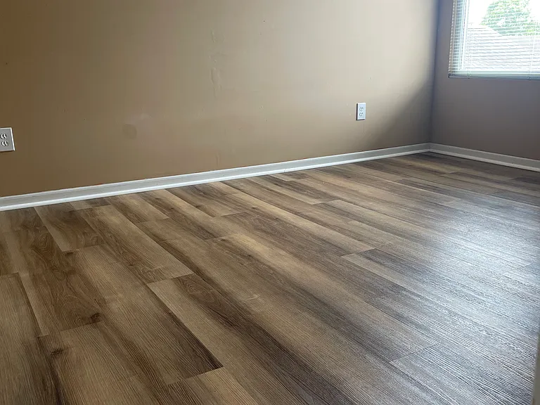 upstairs second bedroom with wood floor