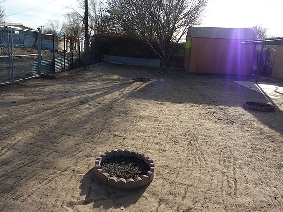 Flower beds and apple tree