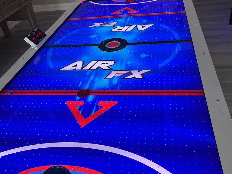 Air hockey table in game room