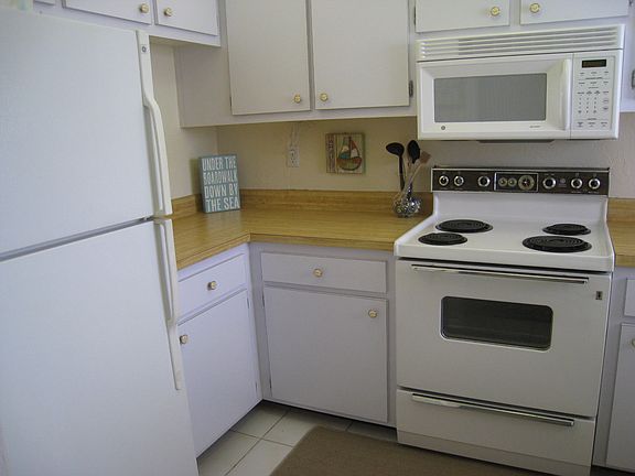 Turnkey kitchen with appliances, dishes, silverware, etc.