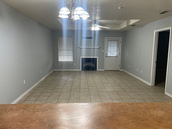 Kitchen facing living room. Door way to master bedroom