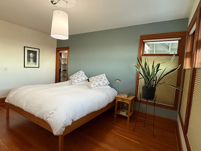 The Primary Bedroom. Windows to the right look out towards the Sound and Olympics.