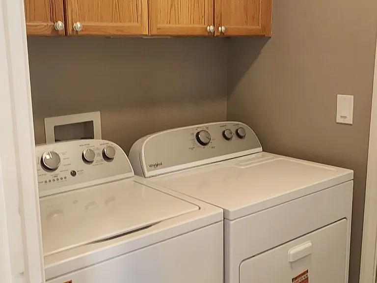 Separate laundry room with brand new washer & dryer