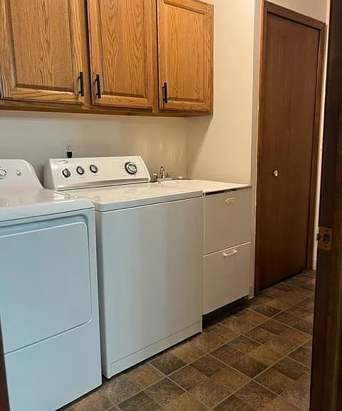 laundry room off of kitchen and 2 car garage. Basement is off of this room