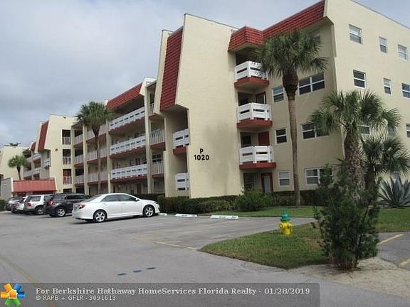 FRONT BUILDING VIEW- WALK ACROSS THE PARKING LOT TO THE CLUBHOUSE