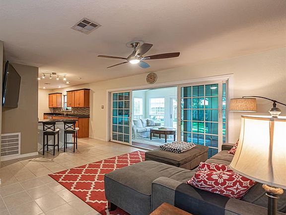Spacious living room that visible from the kitchen and has easy access to the den addition.