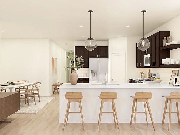 Kitchen with floating shelves and pendant lighting