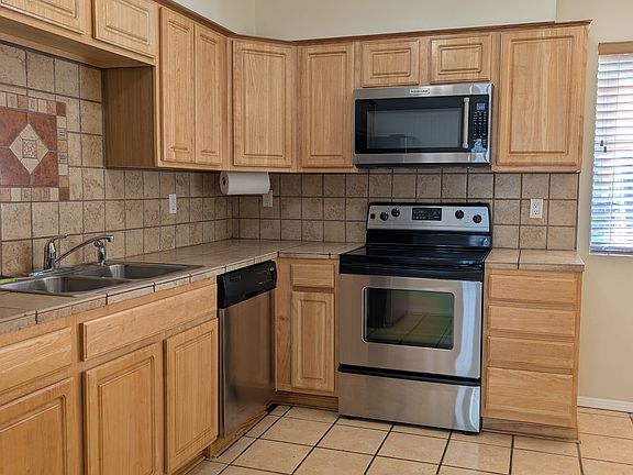 Modern Kitchen with updated appliances and hardwood cabinets