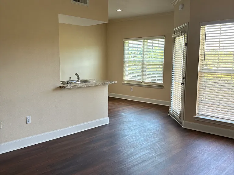 Living room looking toward dining area and kitchen.