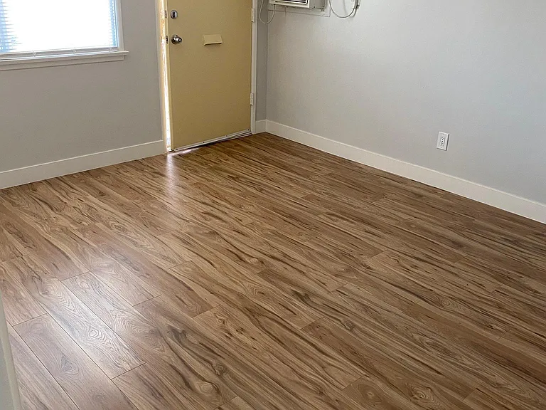 Brand-new flooring and windows
AC unit on wall