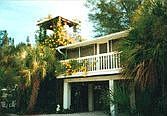 West side exterior showing screened porch