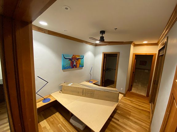 Bedroom/closet with built in king platform and nightstands