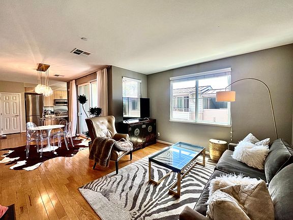 VIEW OF THE LIVING ROOM/DINING AREA/ KITCHEN