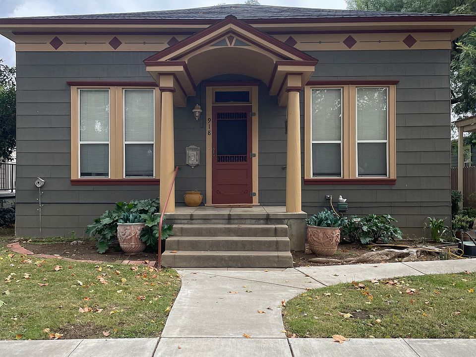 front of home, apartment in back
