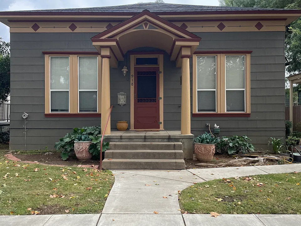 front of home, apartment in back