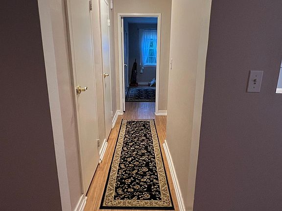 Hallway in unit with additional storage