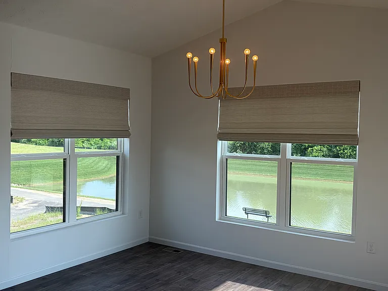 Dining room overlooking pond and deck / patio area