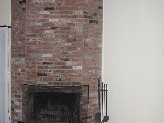 Floor-ceiling brick fireplace
