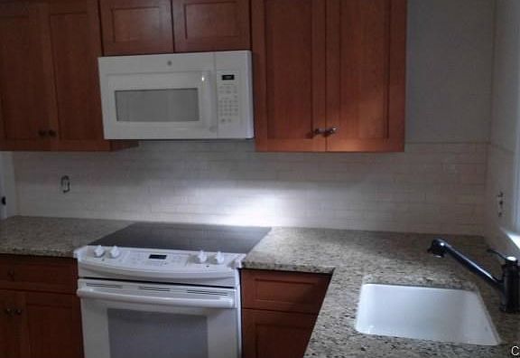 Note the new artisan Italian tiled backsplash to the new ki