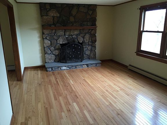 Living room with stone fireplace