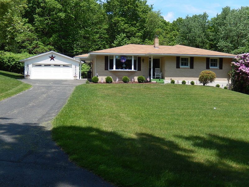 Front : Paved driveway to Oversized 2-car garage and also to lower level.