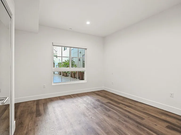 Bedroom with Recessed Lighting, Vinyl Flooring, Large Window