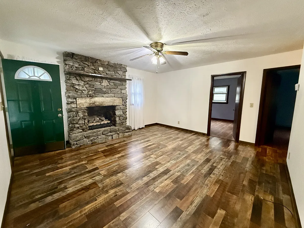Den with beautiful stone fireplace work and gas logs. - 110 Holly Ave